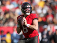 Baker Mayfield, Tampa Bay Buccaneers quarterback preparing to throw a pass. 